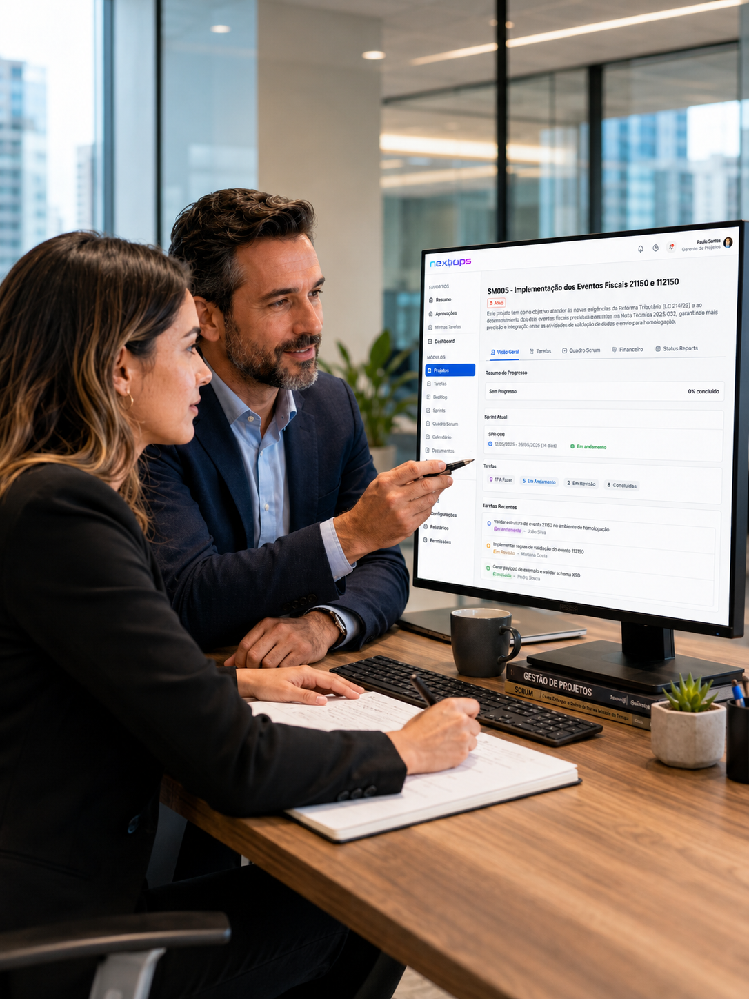 Gestor e analista lado a lado analisando na tela do NEXOOPS a visão geral de um projeto: progresso, sprint atual e tarefas recentes.